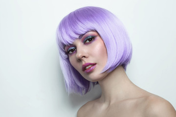 Young beautiful sexy girl with violet hair and fancy make-up