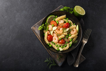 pasta salad with avocado, shrimps, tomato  and grean peas