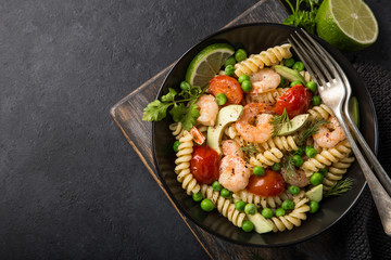 pasta salad with avocado, shrimps, tomato  and grean peas