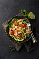 pasta salad with avocado, shrimps, tomato  and grean peas