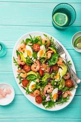 avocado, tomato, eggs and shrimps salad