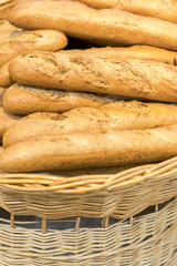 Fresh baguettes in a wicker basket