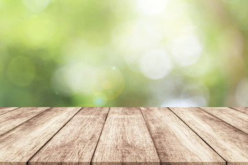 Naklejka na ściany i meble Wood table top on blur nature background with spring or summer