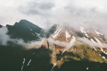 Plakaty  Sunset foggy Mountains peaks and clouds Landscape Summer Travel wild nature scenic aerial view .