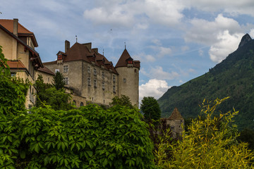 Fototapeta na wymiar Gruyeres, Switzerland - June 10, 2016: Idyllic Medieval the small Castle Swiss Village Gruyeres, Switzerland
