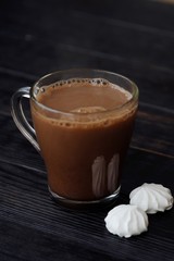 Delicious thick hot chocolate with meringue on the table 