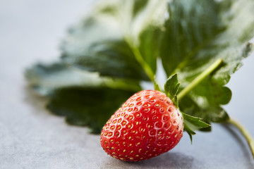 strawberry with leaves on the table