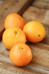 Fresh ripe oranges on the wooden table