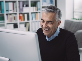 Happy confident manager in his office