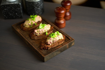 bruschetta, on slices of toasted baguette garnished with basil