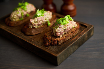 bruschetta, on slices of toasted baguette garnished with basil