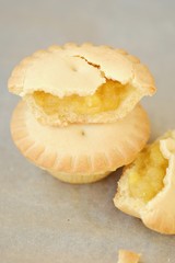 Delicious muffins with pineapples on the table 