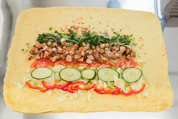 Shawarma with all the ingredients. Unfolded view. Closeup.