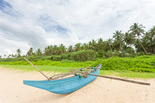 Balapitiya, Sri Lanka - A fishing canoe at the beach of Balapitiya