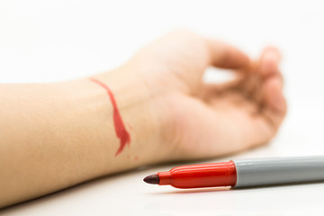 Red pen write down the wrist. Image use for Major depressive disorder, health concept.