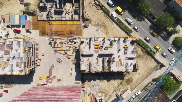 Building Construction Site With Red Scaffolding