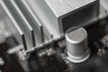 Capacitors and South Bridge Close Up. Computer Motherboard Background. Printed Circuit Board.