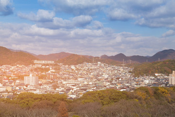 City residence with mountain around during autumn season, Osaka Japan