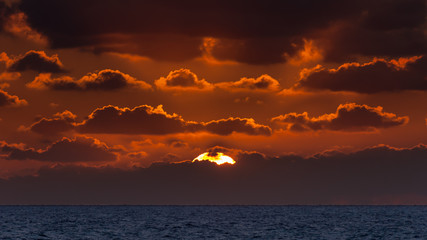 Sunrise with low clouds on Omaha Beach Normandy France