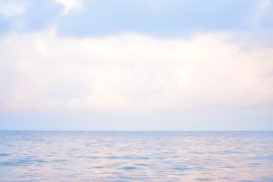 Deep Blue And Pink Sea With Cloudy.