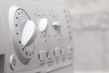 closeup of automatic washing machine control panel, shallow depth of field