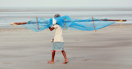 A fisherman going for his daily work