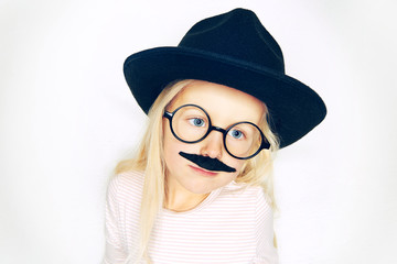 Little blonde girl in hat with moustache