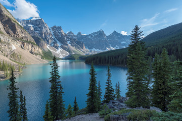 Beautiful turquoise waters of the Moraine Lake at sunset in Rocky Mountains, Banff National Park, Canada.
