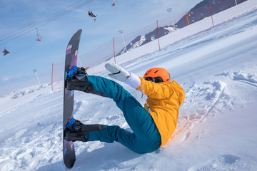 one young woman snowboarding in winter mountains
