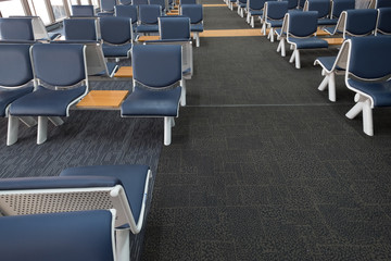 Naklejka premium Empty airport terminal waiting area with chairs lounge with seats in the airport