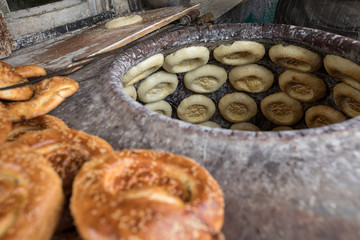 baking naan flat breads in the tradional stove,xinjiang,china