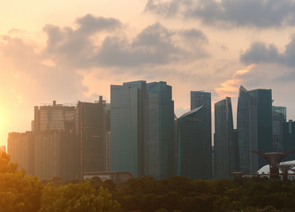 Business buildings in city at sunset