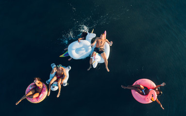 Group of friends having fun on the beach