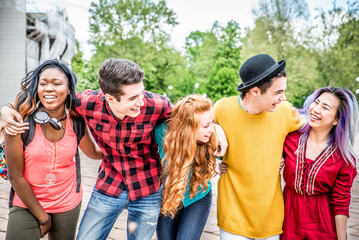 Group of  friends laughing out loud outdoor, sharing good and positive mood.