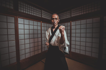 Senior martial art master in his dojo