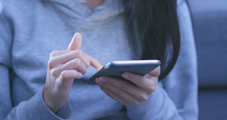 Woman use of mobile phone at night