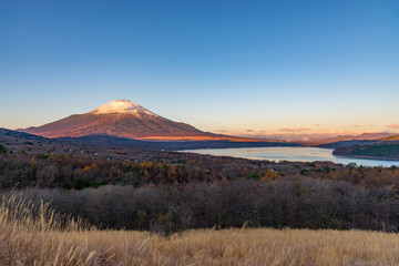 Mountain Fuji with snow cover the peak and lake Yamanakako in early morning view from 360 panoramic view point.