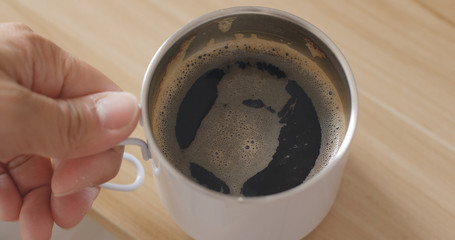 Top view of drinking hot coffee