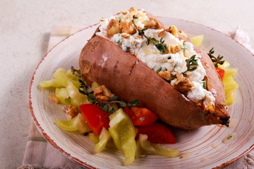Baked sweet potato stuffed with cheese
