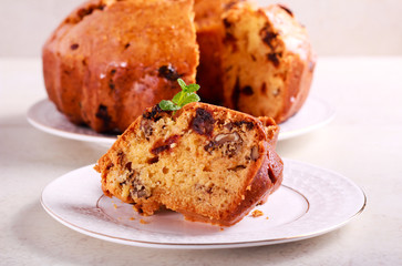 Date and orange ring cake, served