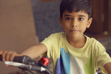 Indian Little Boy with Cycle