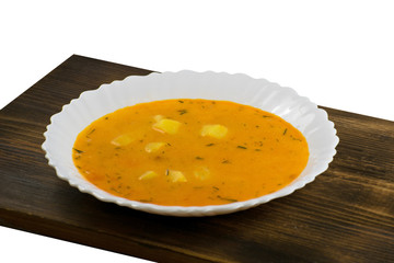 Delicious cheese cream soup on a wooden board. Pumpkin soup.
