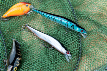 Fishing accessories on the green fishing net
