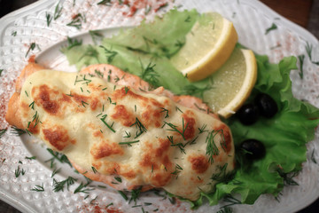 Baked salmon steak with cheese