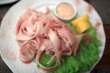 Stroganina made with muksun and sauce