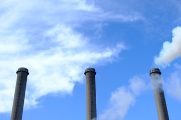 three chimneys and blue sky