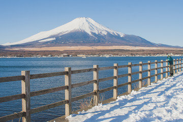 Beautiful landscape view of Fuji mountain or Mt.Fuji covered with white snow in winter seasonal at Yamanaka Lake, Japan.