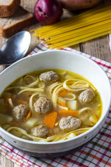 Soup with meatballs and noodles