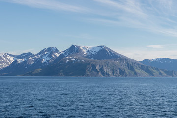 Fototapeta na wymiar Impressive mountain landscape along the coast of northern Norway. 