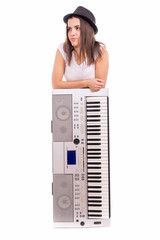 A girl with a hat and a synthesizer